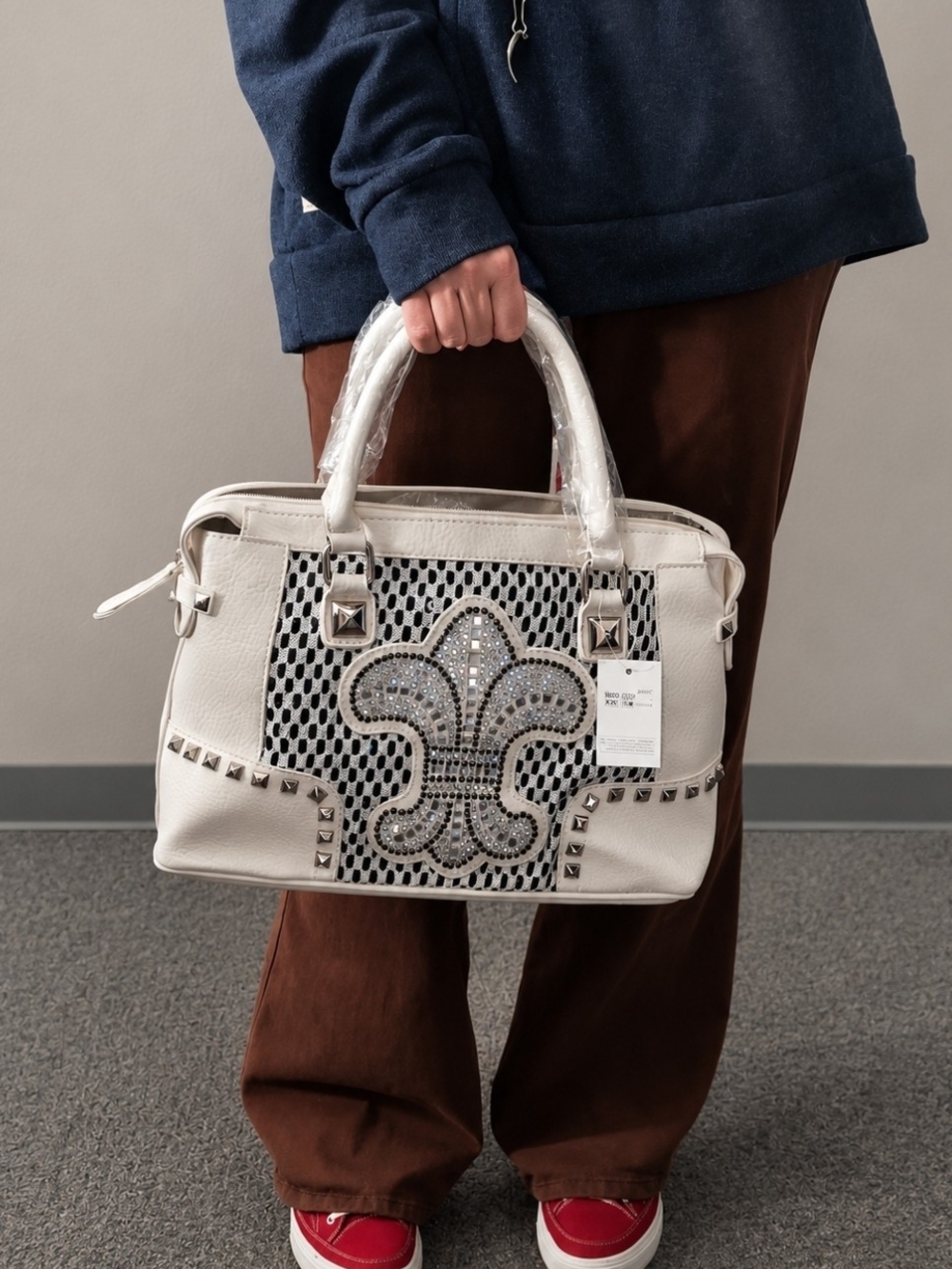 White Studded Leather Tote Bag with Fleur-de-Lis Detail